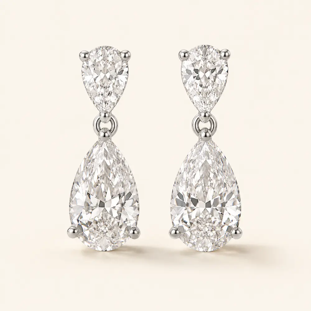 Pear-cut diamond drop earrings in white gold